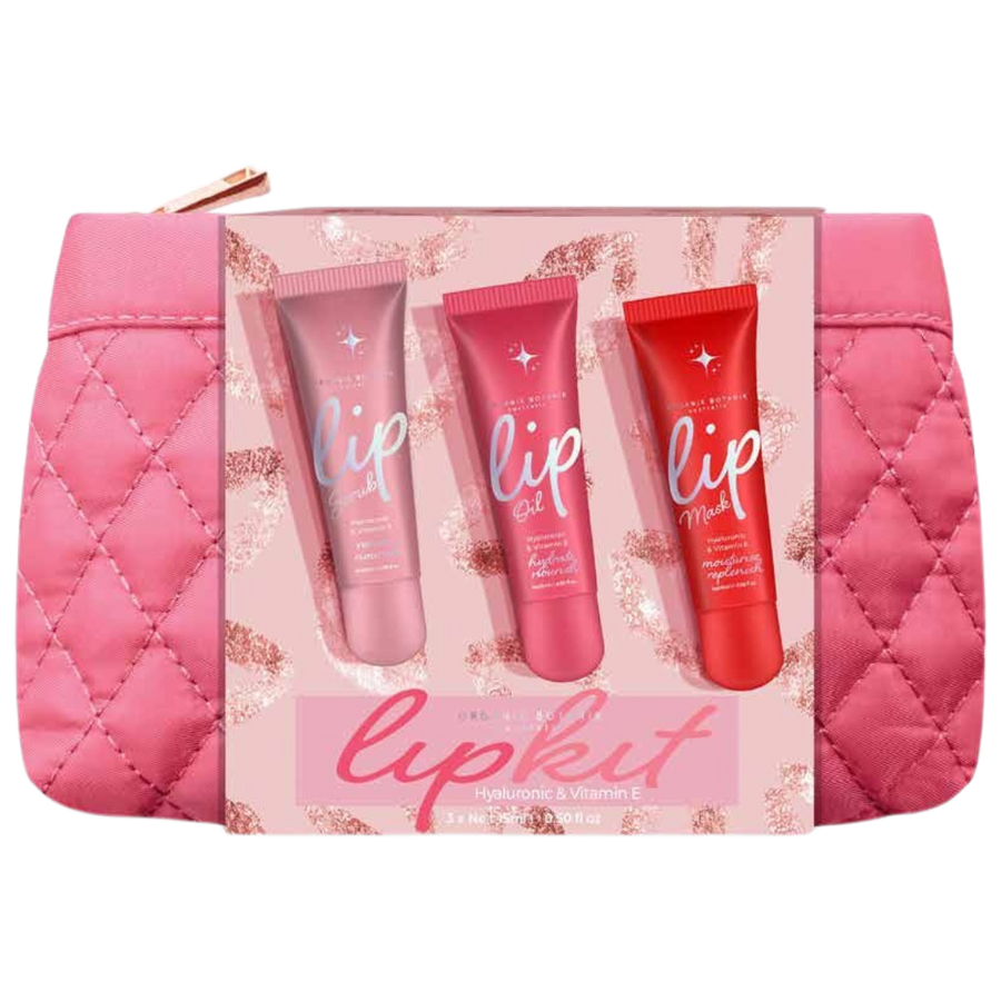 The Cognescenti Pink-Red Lip Kit includes a pink quilted makeup bag with a boxed set of three lip products—gloss, oil, and mask—in pink or red tubes labeled with lip and a star logo.